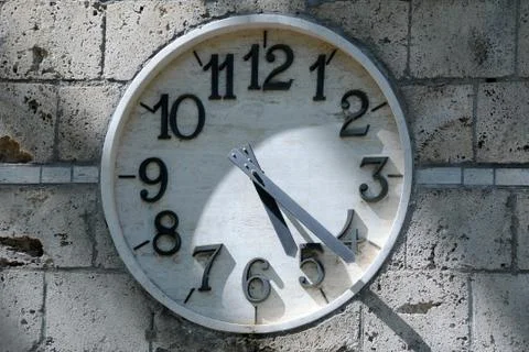 Partially shaded clock face Stock Photos