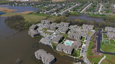 A partially submerged apartment complex after severe flooding in Clarksville Stock Footage 308952301
