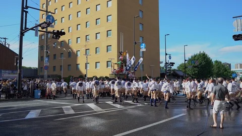 Participants carrying a decoration float during Oiyamanarashi which is a Stock Footage 127912031