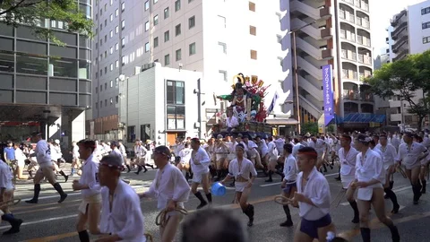 Participants carrying a decoration float during Oiyamanarashi which is a Stock Footage 127912045