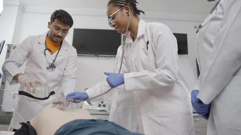 Participants learn essential first aid skills, including CPR assessment Video stock 281363301