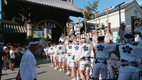 Participants in Traditional Happi Coats Pulling a Festival Float in Osaka Stock Footage 337100711