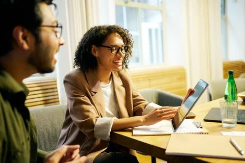 Participating in a Collaborative Team Meeting Utilizing Digital Tools for Stock Photos