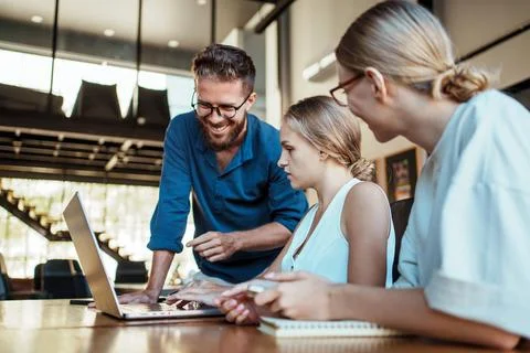 Participating in a Collaborative Team Meeting within a Modern Workspace Stock Photos