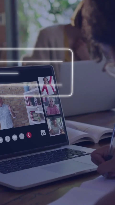 Participating in virtual meeting, person taking notes with laptop at home Stock-Footage 344403988