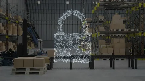 Particle cluster forming padlock hologram, robots loading and palletizing boxes Stock Footage 334373284