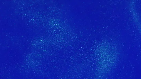 Particles background defocused glitter blue water Stock Footage 255692496