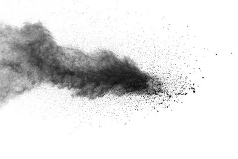 The particles of charcoal splatted on white background. Stock Photos