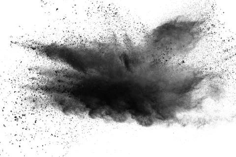 The particles of charcoal splatted on white background. Stock Photos