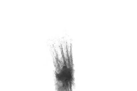 The particles of charcoal splatted on white background. Stock Photos