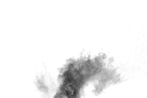 The particles of charcoal splatted on white background. Stock Photos