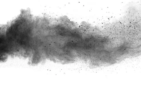 The particles of charcoal splatted on white background. Stock Photos