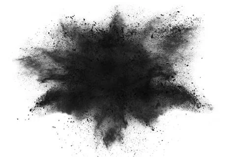 The particles of charcoal splatted on white background. Stock Photos