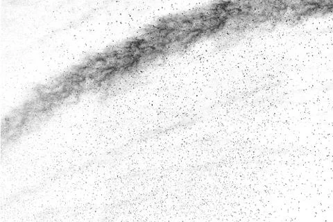 The particles of charcoal splatted on white background. Stock Photos