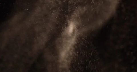 Particles close-up flying in the air over black background. Stock Footage 282619592