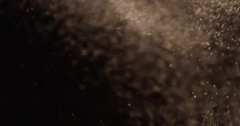 Particles close-up flying in the air over black background. Stock Footage 282619647