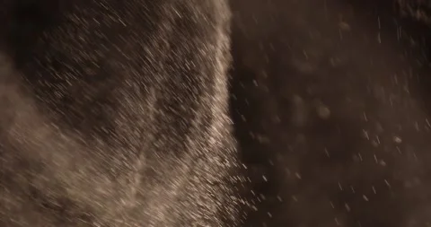 Particles close-up flying in the air over black background. Stock Footage 282619726