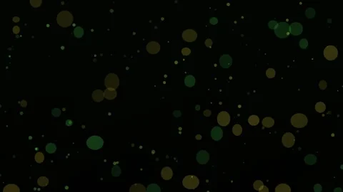 Particles drift across a dark field, forming bokeh-like circles Stock-Footage 329900756