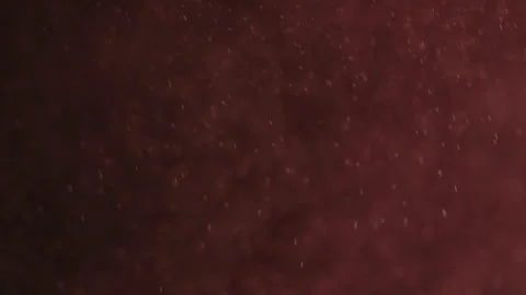 Particles Floating In The Air On A Red Background Stock Footage 252806950