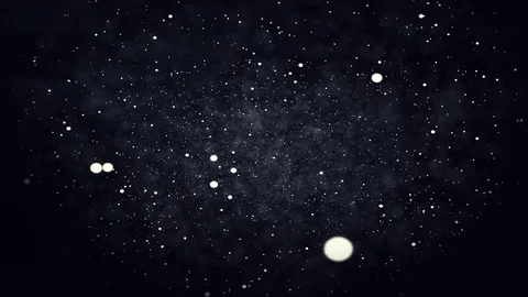 Particles floating on a dark background Видео 100139444