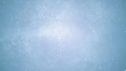 Particles floating in space on a blue ba... | Stock Video | Pond5
