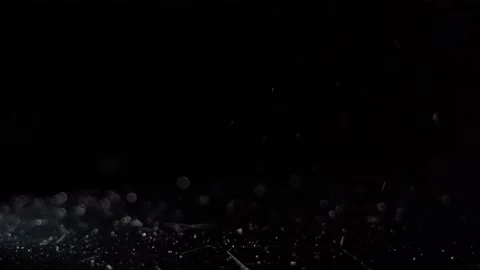 Particles fly in air in dark light 4k. They looking like snow falling on ice Stock Footage 160403683