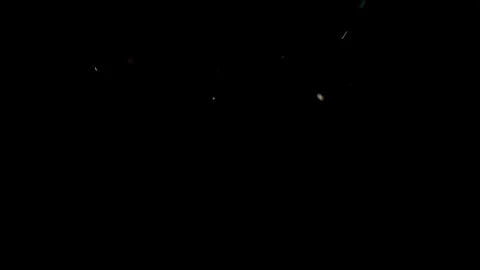 Particles flying on a black background. Colored particles flying erratically Stock Footage 71107910