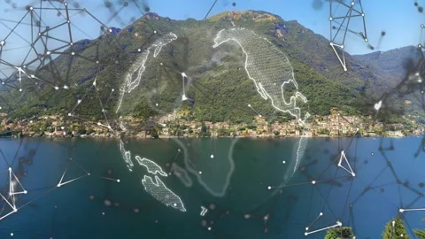 Particles gathering, wireframe globe appearing over lake, rotating and moving Stock Footage 334351722
