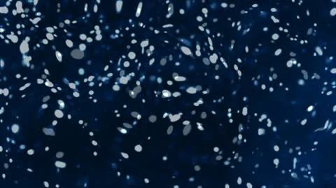 Particles. Molecules as white flakes in the blue liquid. Stock Footage 10683184