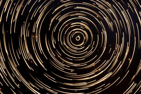 Particles revolves around its center with dark background, 3d rendering. Stock Illustration