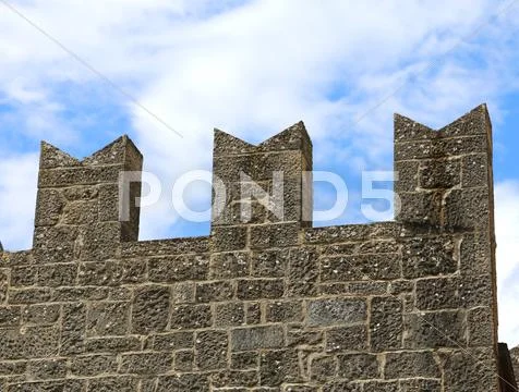 Particular of the battlements of the Tower of the medieval castle Stock Photos