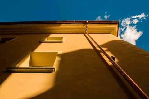 Particular view of a yellow building Stock Photos