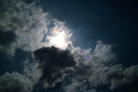 Partly cloudy black background Foto stock