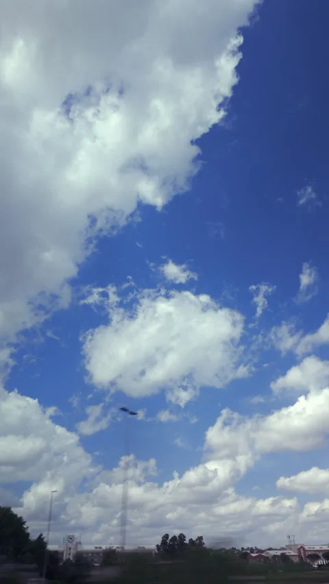 https://images.pond5.com/partly-cloudy-blue-sky-above-footage-315293249_iconl.jpeg