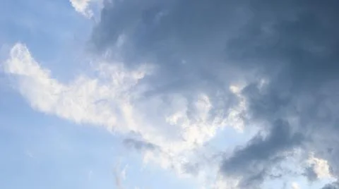 Partly cloudy sky with soft, scattered clouds on a slightly bright day. Per.. Stock Photos
