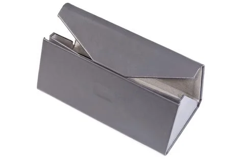 Partly open triangular gray hard spectacle case on white background Stock Photos