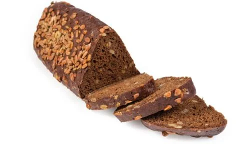 Partly sliced brown bread triangular shape with sunflower seeds closeup 스톡 사진