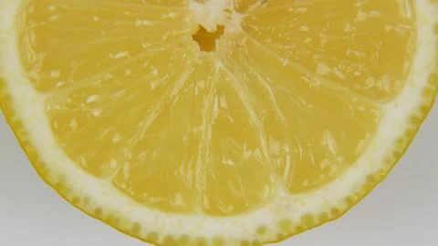 Partly view of rotating lemon slice Stock Footage 138717808