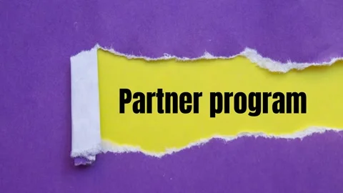 Partner program message writing on ripped torn purple paper Stock Footage 282107813