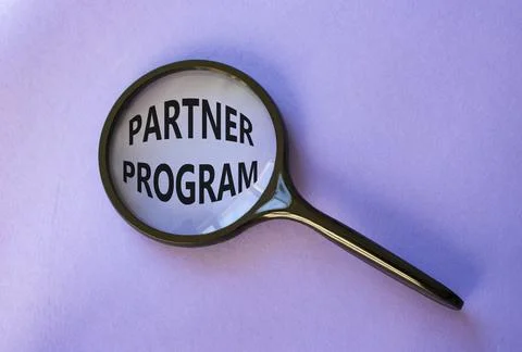 Partner Program symbol. Concept words Partner Program on magnifying glass. .. Stock Photos