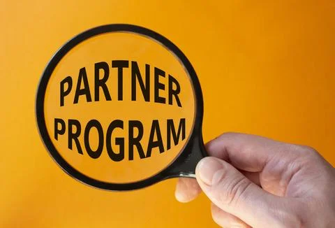 Partner Program symbol. Concept words Partner Program on magnifying glass. .. Stock Photos