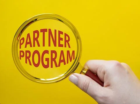 Partner Program symbol. Concept words Partner Program on magnifying glass. .. Stock Photos