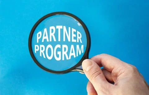 Partner Program symbol. Concept words Partner Program on magnifying glass. .. Stock Photos