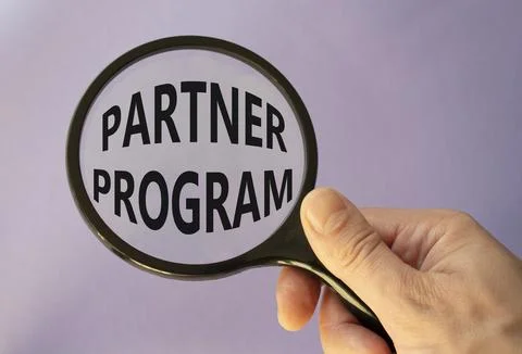 Partner Program symbol. Concept words Partner Program on magnifying glass. .. Stock Photos