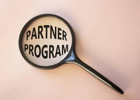 Partner Program symbol. Concept words Partner Program on magnifying glass. .. Stock Photos