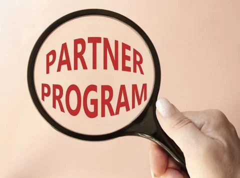 Partner Program symbol. Concept words Partner Program on magnifying glass. .. Stock Photos