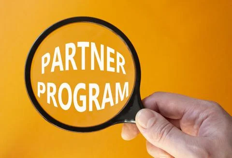 Partner Program symbol. Concept words Partner Program on magnifying glass. .. Stock Photos