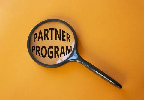 Partner Program symbol. Concept words Partner Program on magnifying glass. .. Stock Photos