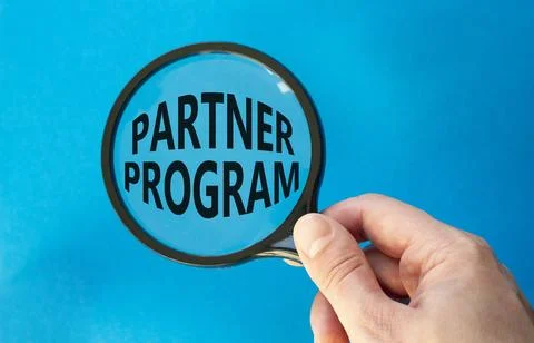 Partner Program symbol. Concept words Partner Program on magnifying glass. .. Stock Photos