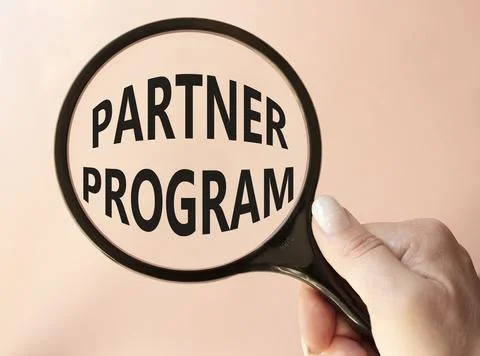 Partner Program symbol. Concept words Partner Program on magnifying glass. .. Stock Photos